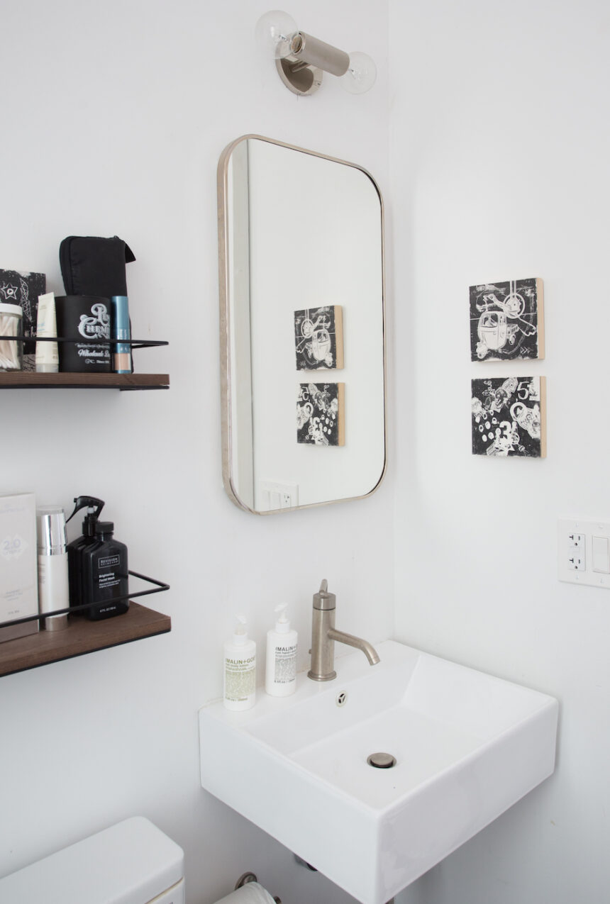 white-bathroom-with-mirror-and-shelves