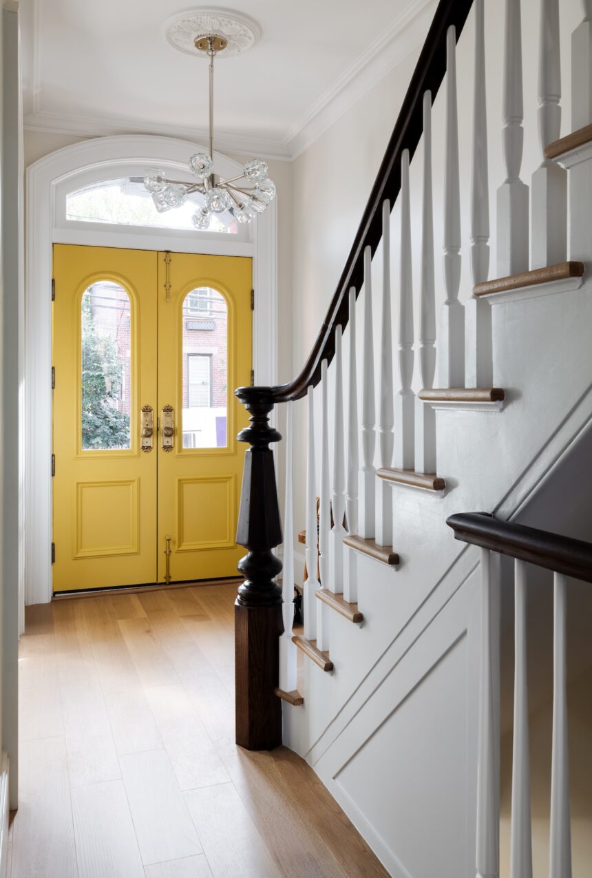 staircase-and-yellow-front-door